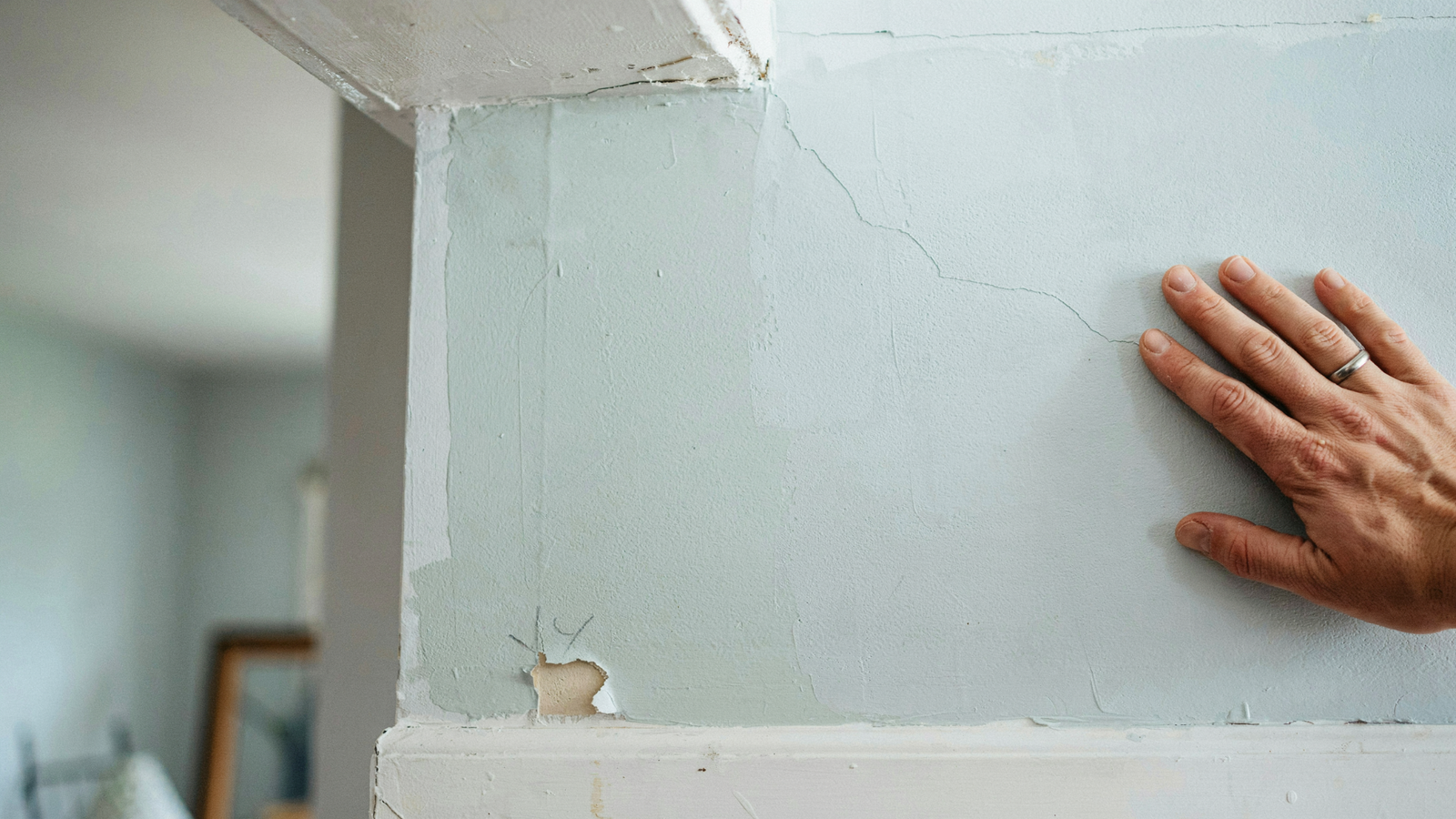 Interior wall showing signs of excessive paint buildup from multiple repainting cycles.