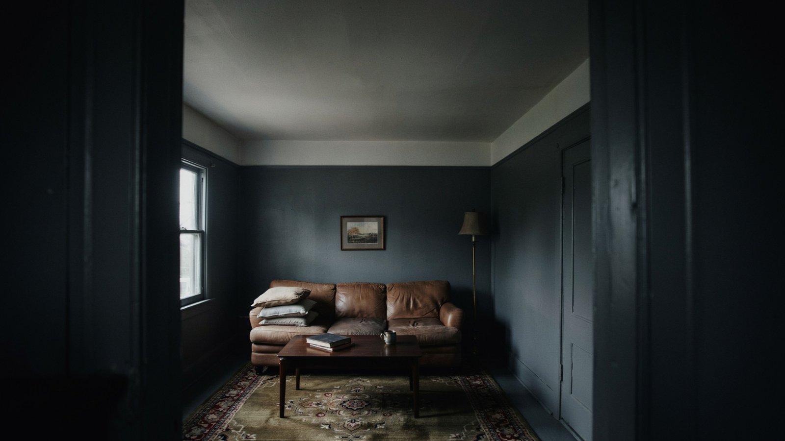 Dark green dining room demonstrating how deep colors can add depth and openness.