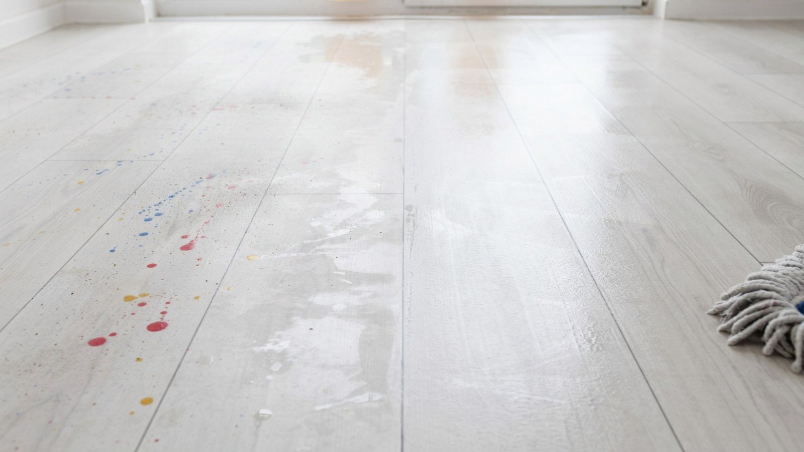 Removing dried paint from vinyl flooring.