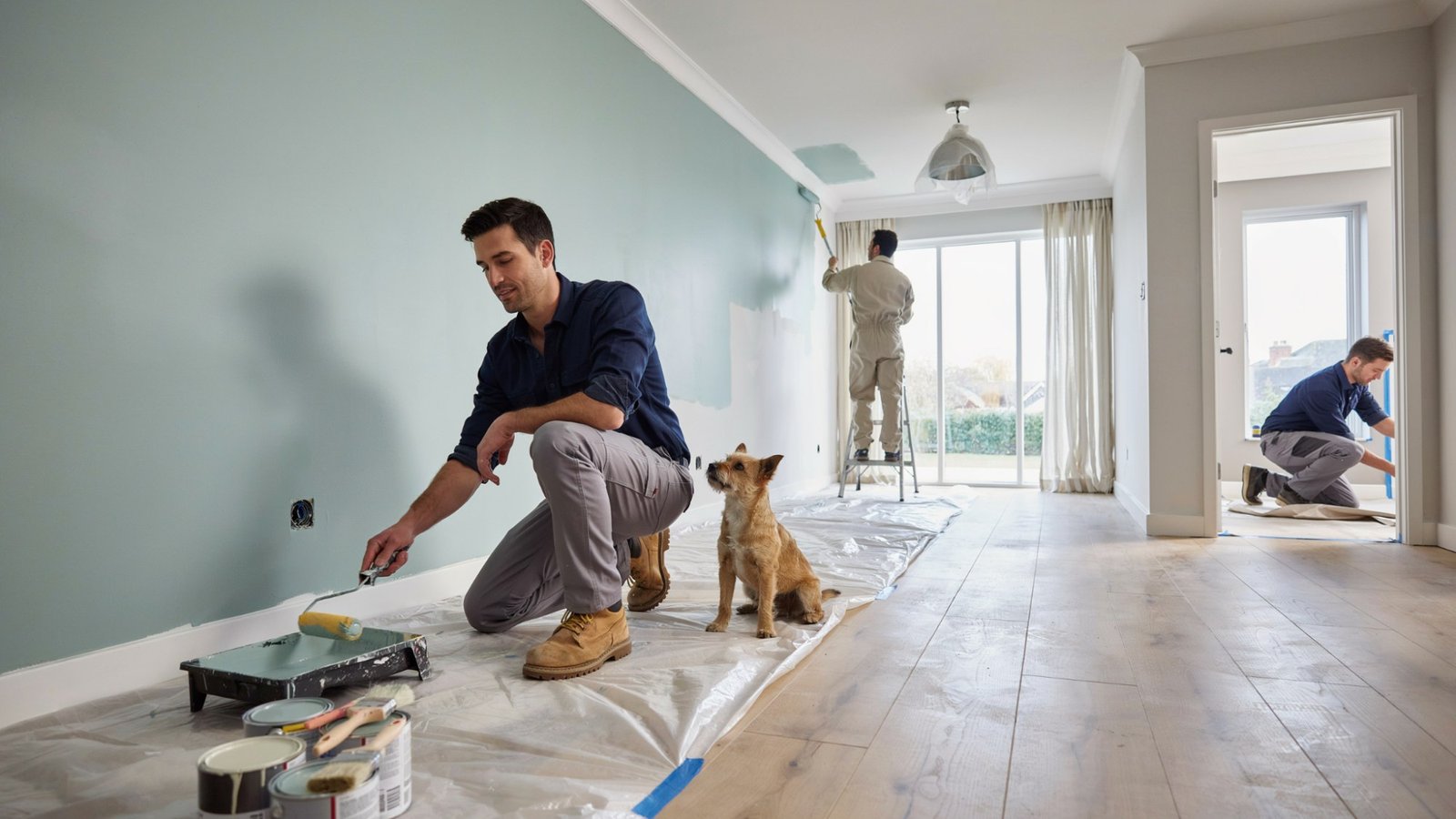 Interior house painting project showing multiple freshly painted rooms