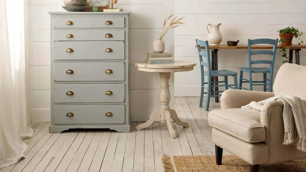 Collection of distressed chalk-painted furniture in a farmhouse-style room.