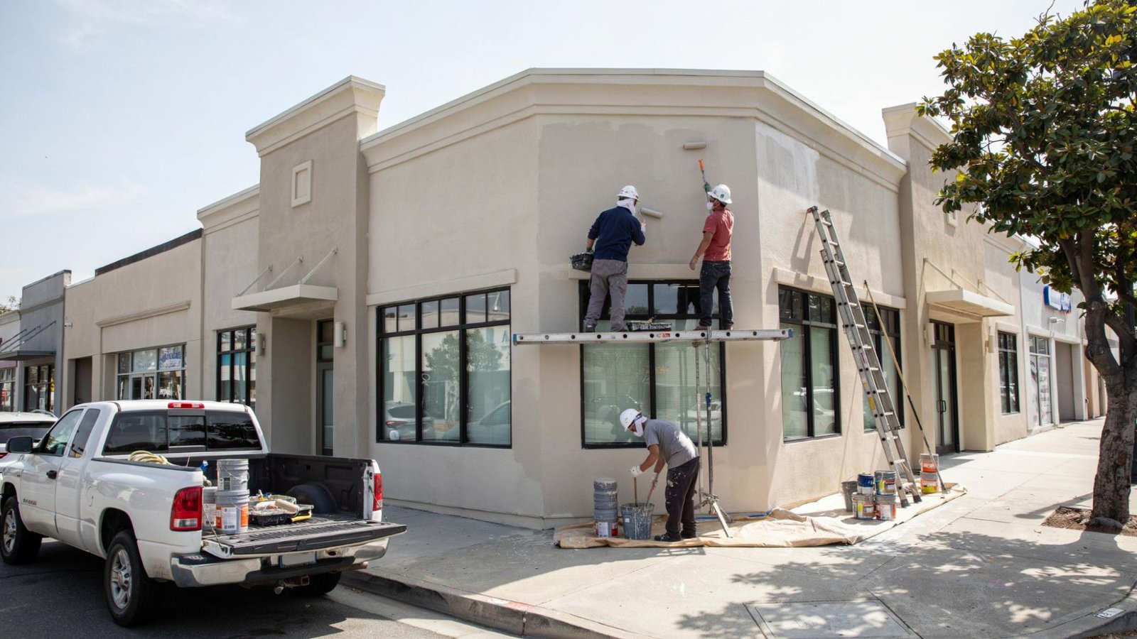 Commercial building protected with elastomeric exterior coating.