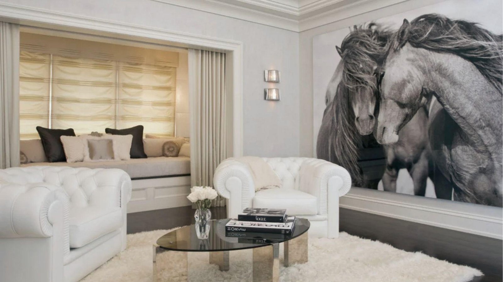 Classy white living room with large horse mural accent wall and tufted sofas near window nook