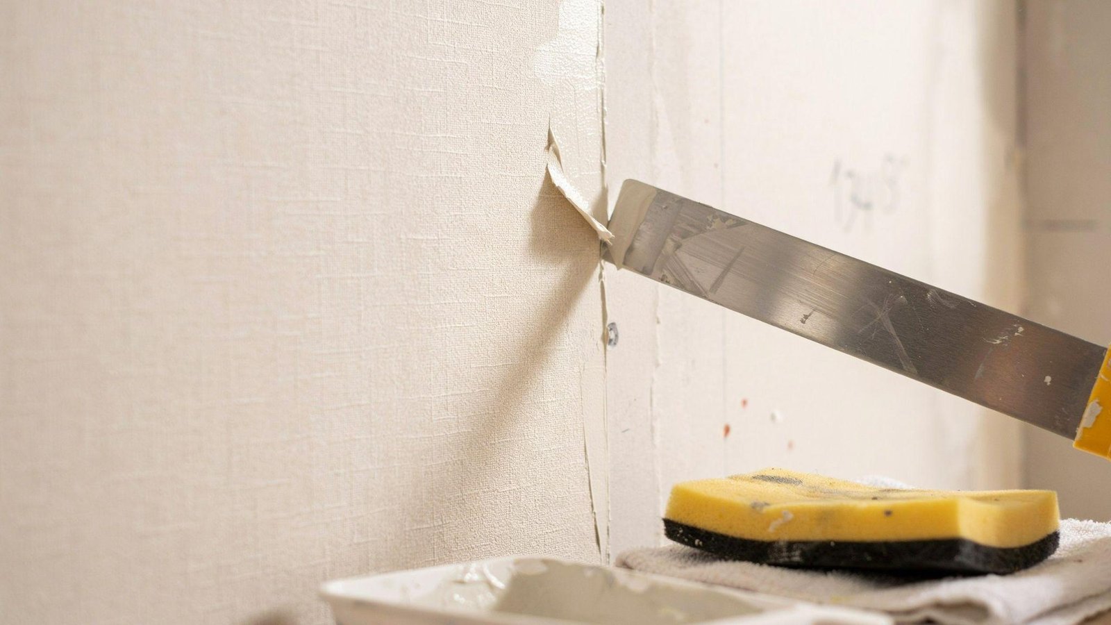 Wallpaper seam repair, feathering, and sanding preparation before skim coating and painting