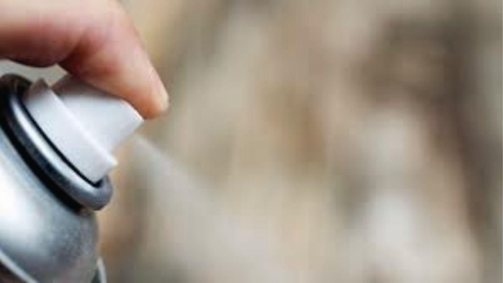 Finger pressing spray paint nozzle causes cracking when applied too close to surface