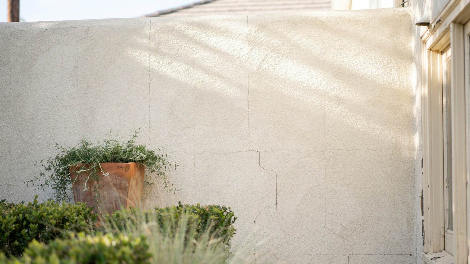 Benefits of elastomeric paint on stucco surfaces.