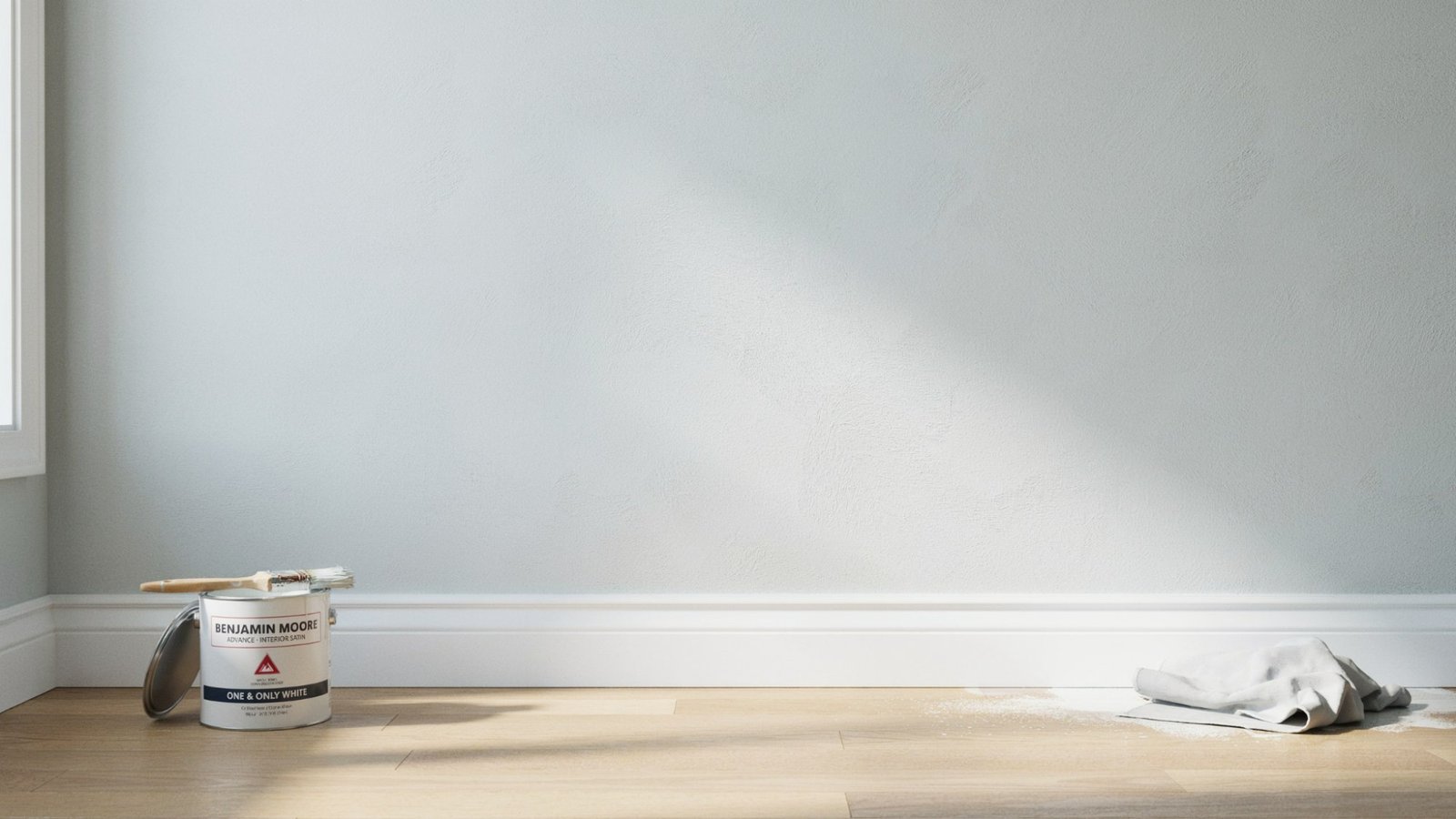 Baseboards drying after first coat with light sanding and second coat applied for smooth even finish indoors.