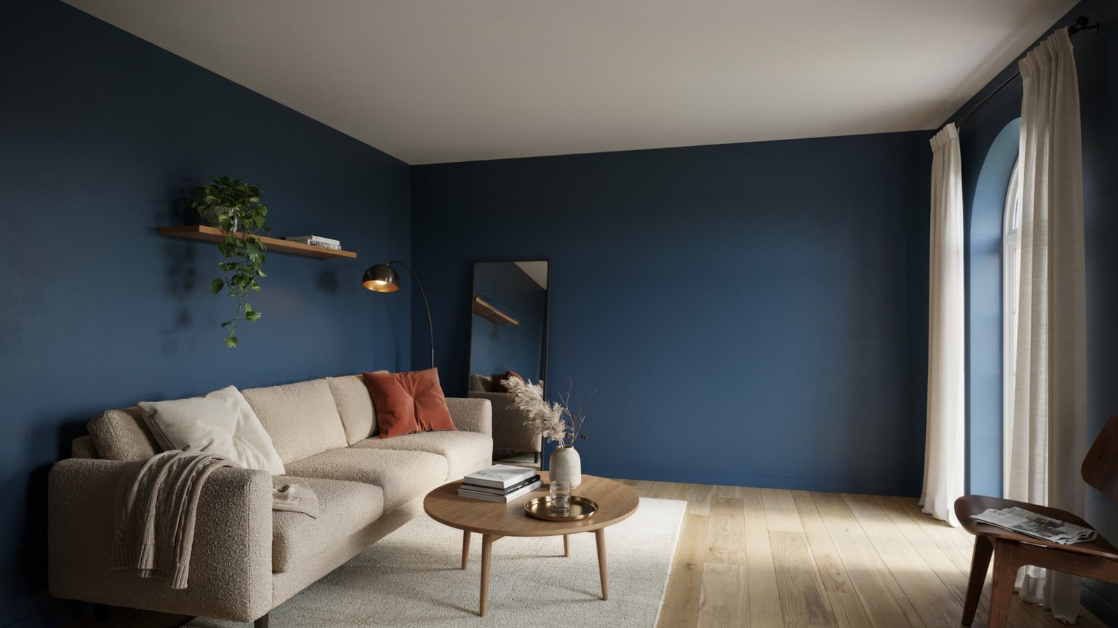 Small room with dark navy walls, bright lighting, and a mirror showing how dark paint can still create a spacious feel.